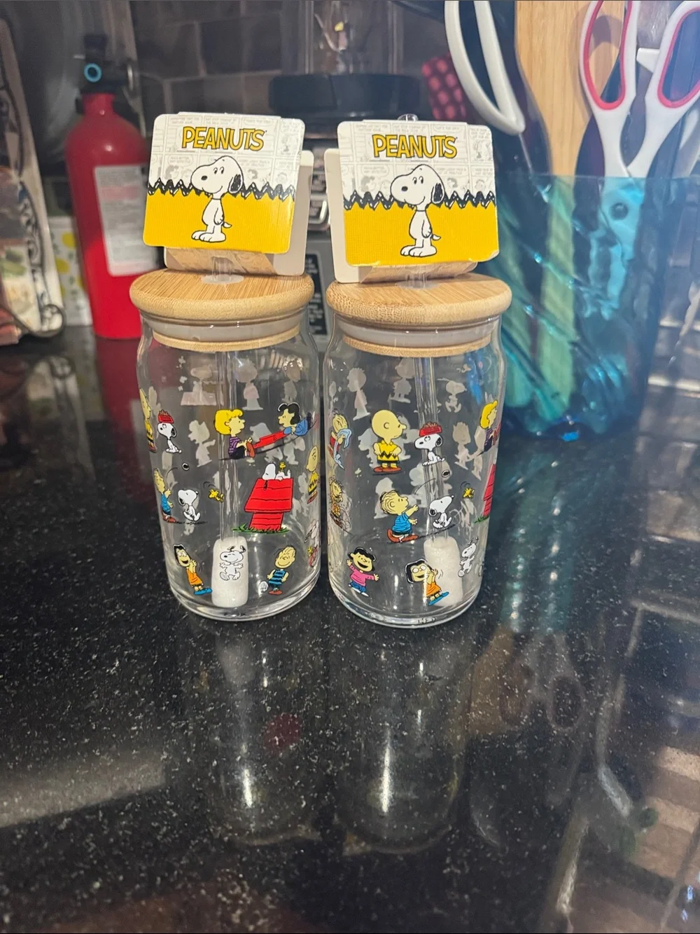 Peanuts Glass Canister Pair with Yellow Snoopy Toppers